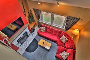 an overhead view of a living room with a red couch at Cozy,1 bedroom loft condo! Ski back trails, shuttle& Sports center Highridge E11 in Killington