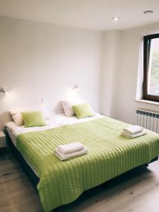 Кровать или кровати в номере Świerkowe Zacisze hotel