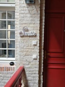 a building with the word milk written on the side of it at Smile in Dieppe