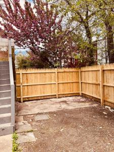 a wooden fence in front of a yard at 9 Bedroom, 14 Beds House Great for Big Groups Near Boardwalk, Tropicana in Atlantic City