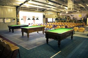 a room with two pool tables and chairs at BIG4 Casino Holiday Park in Casino