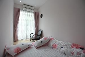 A bed or beds in a room at NEW BOUTIQUE HOMESTAY