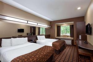 เตียงในห้องที่ Microtel Inn & Suites by Wyndham Columbia