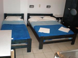 Een bed of bedden in een kamer bij Chrysa