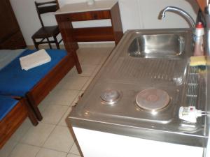 a kitchen with a sink and a counter top at Chrysa in Antiparos