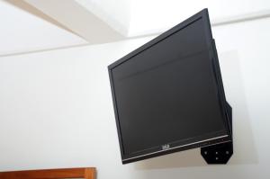 TV a/nebo společenská místnost v ubytování Hotel Delfines - a 2 calles del Acuario Veracruz