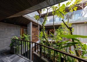a balcony of a house with plants at Minh Boutique in Danang