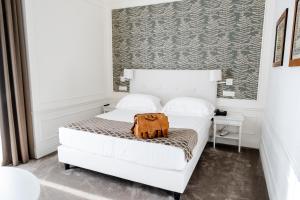 Postel nebo postele na pokoji v ubytování Grand Hotel Palace