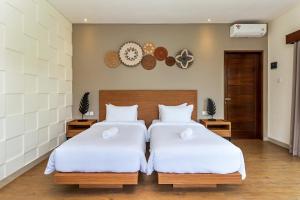 Postel nebo postele na pokoji v ubytování Annupuri Villas Bali