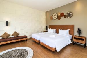 Postel nebo postele na pokoji v ubytování Annupuri Villas Bali
