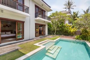 Bazén v ubytování Annupuri Villas Bali nebo v jeho okolí