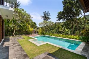 Bazén v ubytování Annupuri Villas Bali nebo v jeho okolí