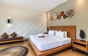 Postel nebo postele na pokoji v ubytování Annupuri Villas Bali + 36 fotografií
