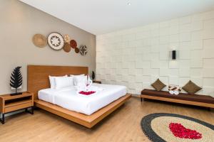Postel nebo postele na pokoji v ubytování Annupuri Villas Bali