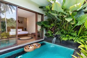 Bazén v ubytování Annupuri Villas Bali nebo v jeho okolí