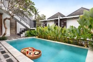 Bazén v ubytování Annupuri Villas Bali nebo v jeho okolí