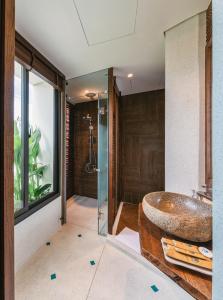 a bathroom with a large sink and a shower at Minh Boutique in Danang