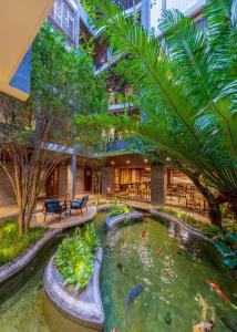 a koi pond in the middle of a building at Minh Boutique in Danang