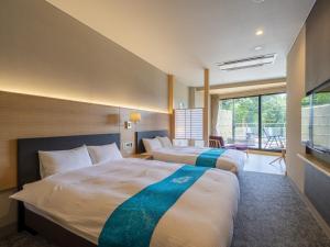 Postel nebo postele na pokoji v ubytování Hotel Sekisuien + 37 fotografií