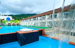 a swimming pool on the roof of a building at PJ Patong Resortel in Patong Beach