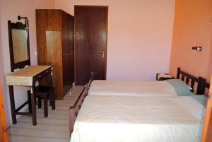 Postel nebo postele na pokoji v ubytování Hotel Olga