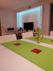 a room with a table with a cactus on it at Alex House in Cagliari