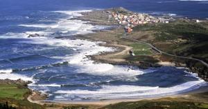 an aerial view of the ocean and a beach at Piso O Percebe in Muxia