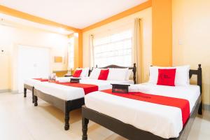 Voodi või voodid majutusasutuse RedDoorz Premium @ Gabinete Road Palawan toas