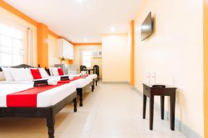 Voodi või voodid majutusasutuse RedDoorz Premium @ Gabinete Road Palawan toas