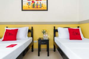 Voodi või voodid majutusasutuse RedDoorz Premium @ Gabinete Road Palawan toas