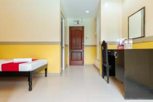 Voodi või voodid majutusasutuse RedDoorz Premium @ Gabinete Road Palawan toas
