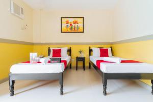 Voodi või voodid majutusasutuse RedDoorz Premium @ Gabinete Road Palawan toas