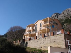 a building on top of a brick wall at NEW STUDIO MUO in Kotor
