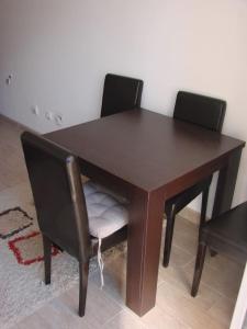 a wooden table with two black chairs around it at NEW STUDIO MUO in Kotor +17 photos