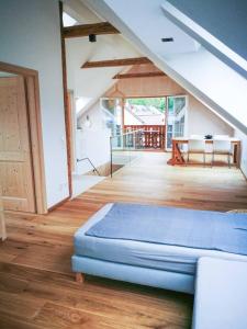 a bedroom with a mattress on a wooden floor at Ferienwohnung in Abersee