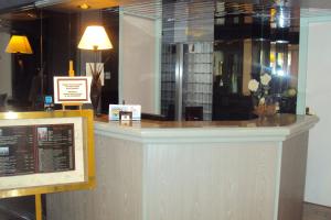 Лобби или стойка регистрации в Hôtel 4C