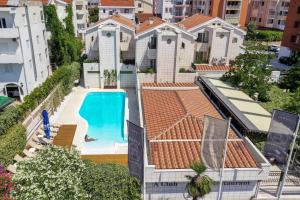 an aerial view of a house with a swimming pool at Hotel Admiral in Budva