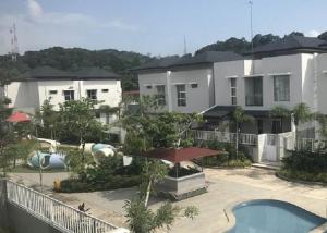 a building with a swimming pool and a resort at SleepRest @ The Home Shoutlink in Nagoya +13 photos