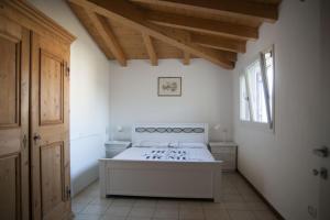מיטה או מיטות בחדר ב-Gli astri di San Lorenzo