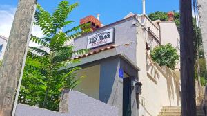 a building with a sign on the side of it at Apartments Rock Palace in Dubrovnik