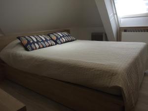Una cama o camas en una habitación de Peak Center Konaci
