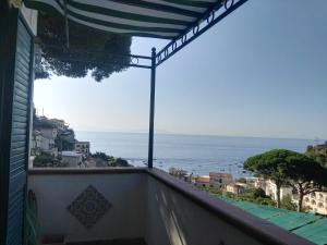 a view of the ocean from the balcony of a house at Casa Vacanze Bouganvillea in Cetara