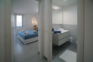 Krevet ili kreveti u jedinici u okviru objekta Oliver's House Sardinia