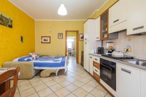 a kitchen with a bed in the middle of a room at La Collina in Salerno