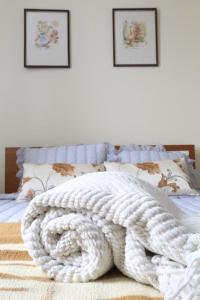 Postel nebo postele na pokoji v ubytování Rochinha Cozy Home