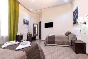 Televízia a/alebo spoločenská miestnosť v ubytovaní Mia Resort