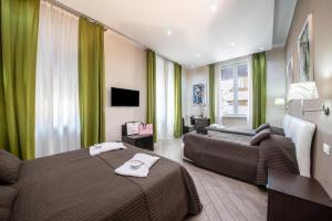 Televízia a/alebo spoločenská miestnosť v ubytovaní Mia Resort