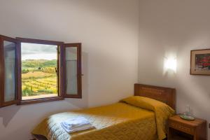 Rúm í herbergi á Torre nel Chianti