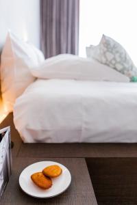 Letto o letti in una camera di Notarishuys "Pure Hotel"