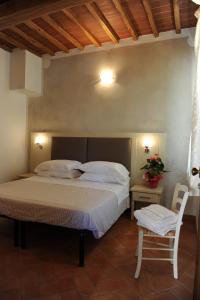 A bed or beds in a room at Super Relais Stella